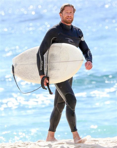 Colin Jost strips off to go surfing after low Emmys viewing figures